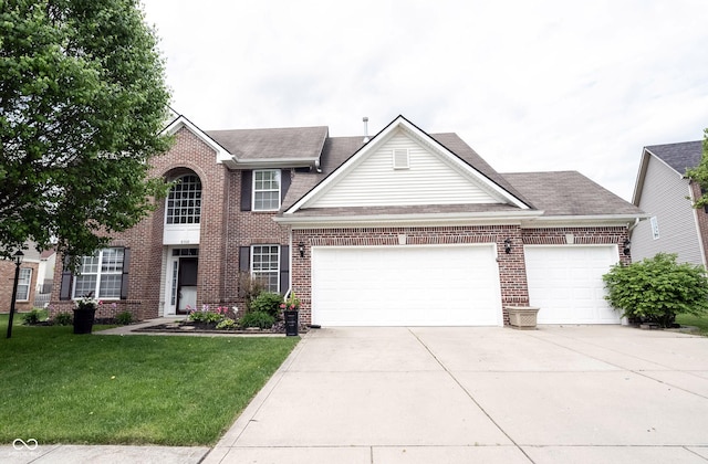 8748 N Autumnview Dr, Mccordsville, IN 46055 - view of front facade featuring a front yard, roof with shingles, brick siding, an attached garage, and driveway