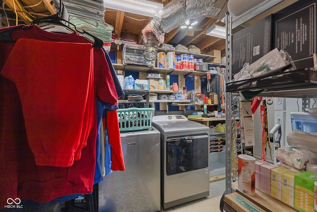 clothes washing area with washer and dryer and laundry area