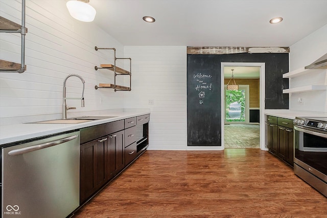 701 Hawthorn Rd, New Castle, IN 47362 - kitchen with open shelves, appliances with stainless steel finishes, light countertops, wood finished floors, and dark brown cabinetry