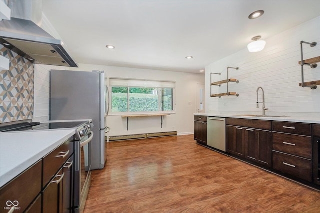 701 Hawthorn Rd, New Castle, IN 47362 - kitchen with stainless steel appliances, extractor fan, a baseboard heating unit, backsplash, and dark brown cabinetry