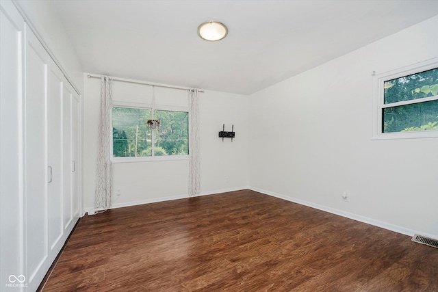 701 Hawthorn Rd, New Castle, IN 47362 - unfurnished bedroom featuring dark wood finished floors and a closet