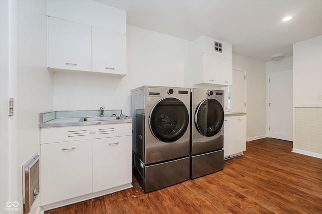 701 Hawthorn Rd, New Castle, IN 47362 - laundry area with washing machine and clothes dryer, cabinet space, and dark wood-type flooring