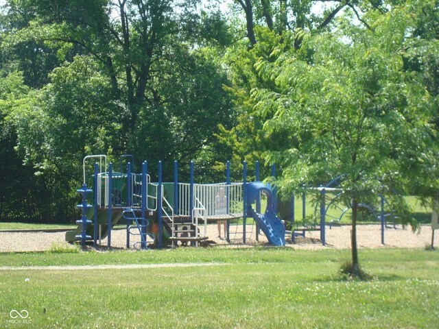 community play area featuring a lawn