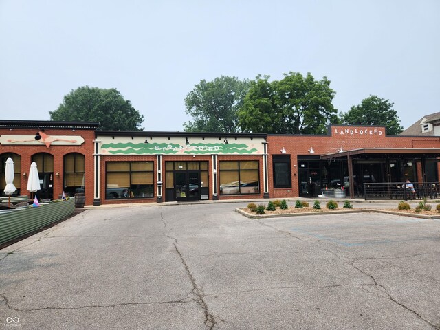 view of commercial location featuring uncovered parking