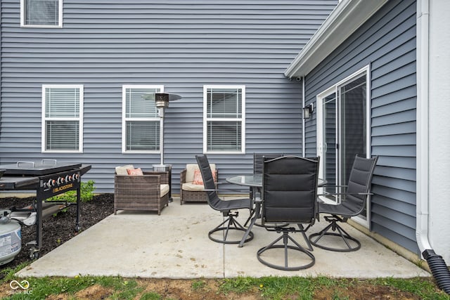 view of patio featuring outdoor dining area