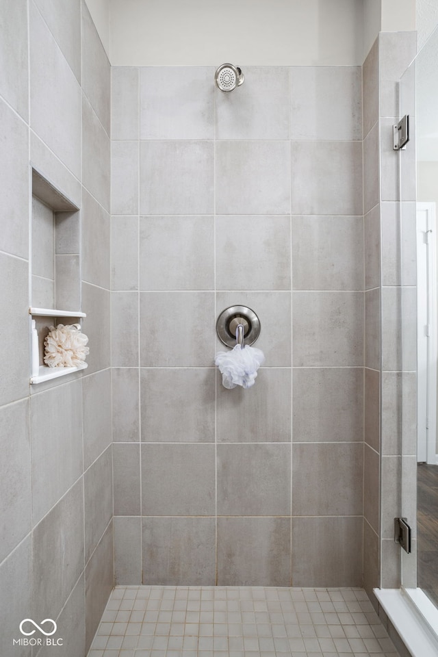 full bath featuring a shower stall