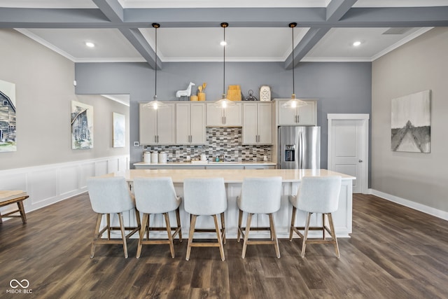 kitchen featuring light countertops, stainless steel fridge with ice dispenser, tasteful backsplash, and coffered ceiling