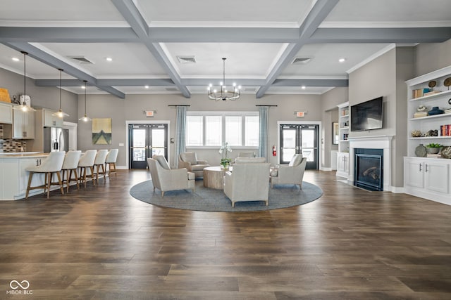living room with french doors, dark wood-style flooring, a glass covered fireplace, and visible vents
