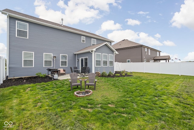 back of house with a yard, a patio, and a fenced backyard