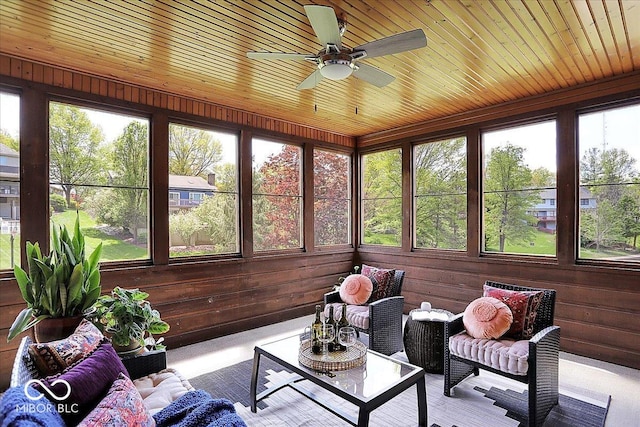 sunroom / solarium featuring an outdoor living space and a ceiling fan