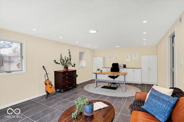 office featuring dark tile patterned floors, recessed lighting, baseboards, and visible vents