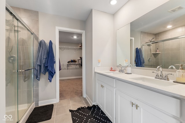 8673 Laurelton Pl, Brownsburg, IN 46112 - full bathroom with a walk in closet, visible vents, a stall shower, and a sink