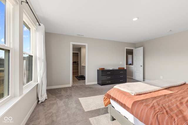 8673 Laurelton Pl, Brownsburg, IN 46112 - bedroom featuring recessed lighting, visible vents, ensuite bath, baseboards, and light colored carpet