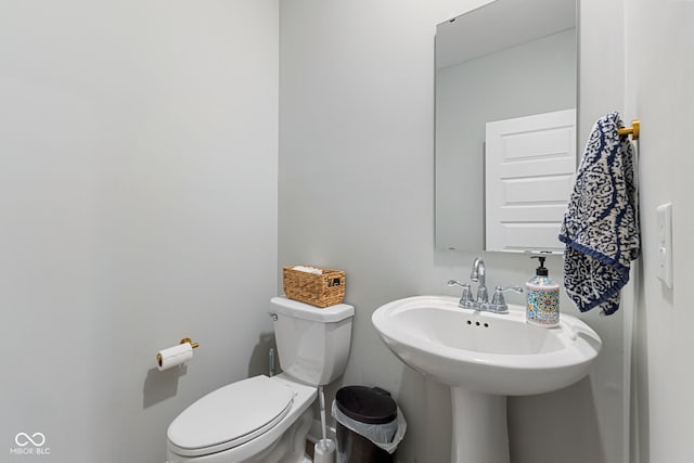 8673 Laurelton Pl, Brownsburg, IN 46112 - bathroom featuring baseboards, a sink, and toilet