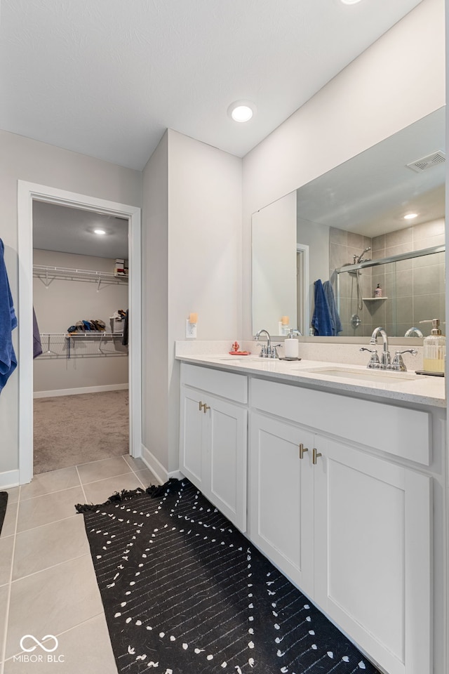 8673 Laurelton Pl, Brownsburg, IN 46112 - full bath with tile patterned flooring, a sink, a spacious closet, and a stall shower