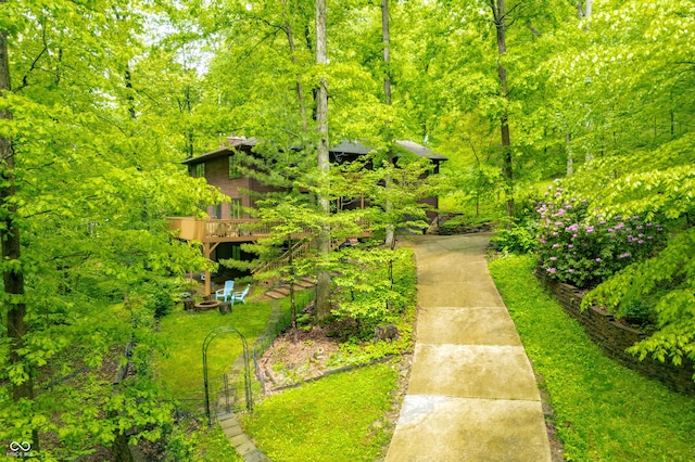 13306 W 50 S, Columbus, IN 47201 - surrounding community featuring a wooden deck, driveway, and a view of trees