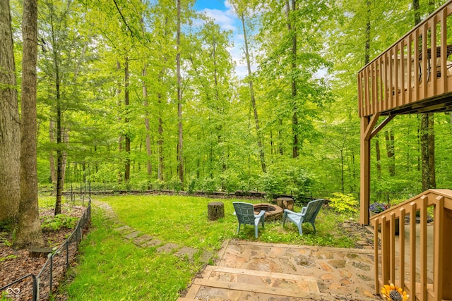 13306 W 50 S, Columbus, IN 47201 - view of green lawn with an outdoor fire pit, a deck, and a forest view