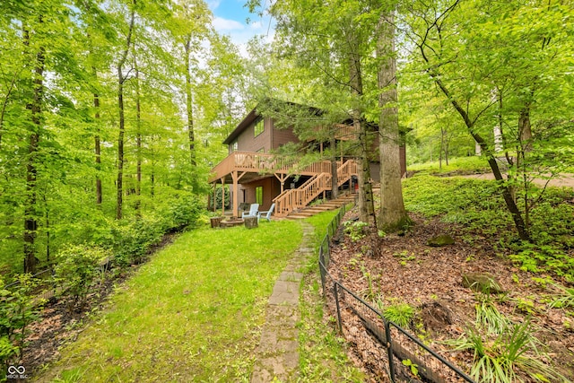 13306 W 50 S, Columbus, IN 47201 - view of yard with a wooden deck, stairs, and a forest view