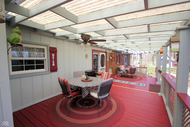 deck with a pergola, a ceiling fan, and outdoor dining space