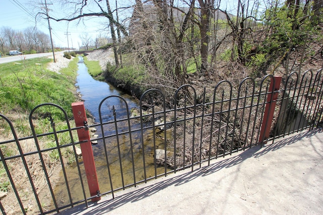 view of gate with fence