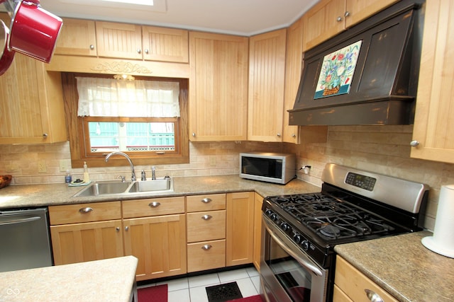 kitchen featuring ventilation hood, stainless steel appliances, light brown cabinets, and a sink