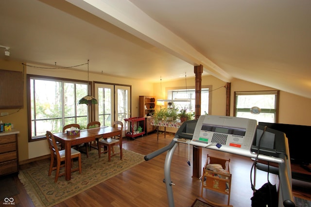 home office with wood finished floors and lofted ceiling