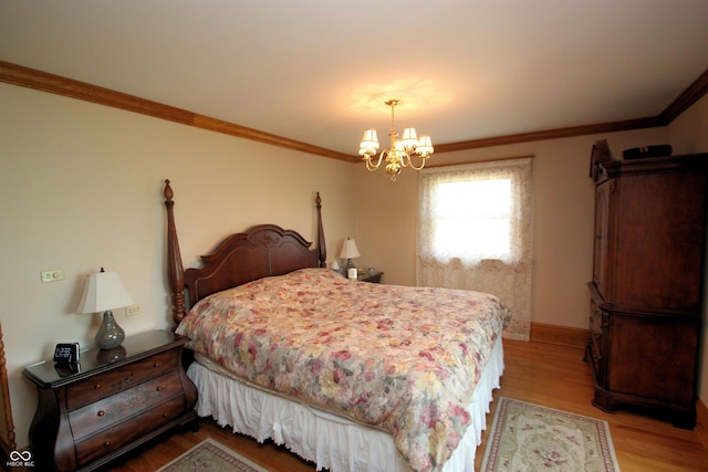 bedroom featuring an inviting chandelier, light wood-style flooring, baseboards, and crown molding