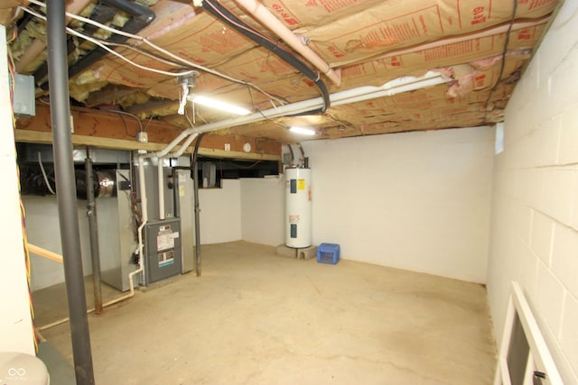 unfinished below grade area with water heater, heating unit, and concrete block wall