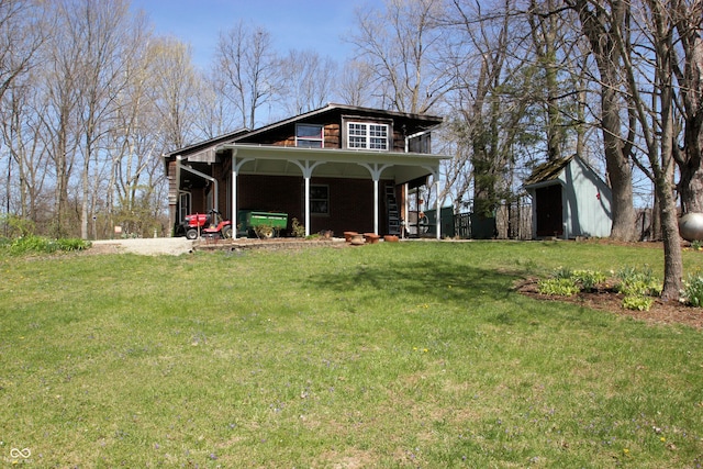 exterior space with a front lawn and an outbuilding