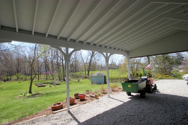 view of patio / terrace featuring an outbuilding and a shed