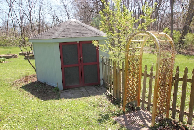 view of shed with fence