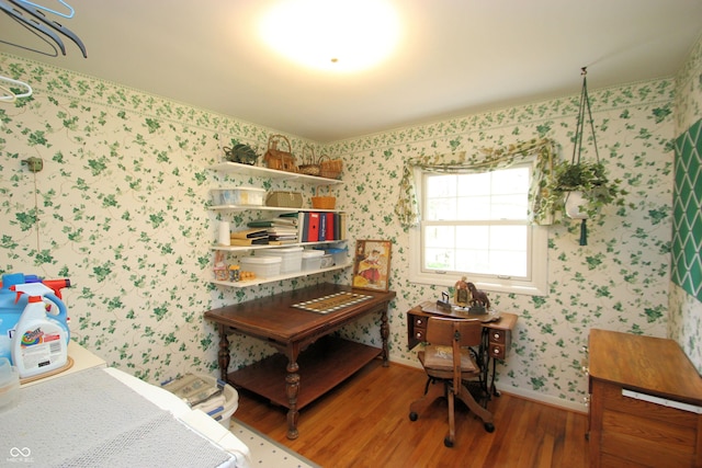 home office featuring baseboards, wallpapered walls, and wood finished floors