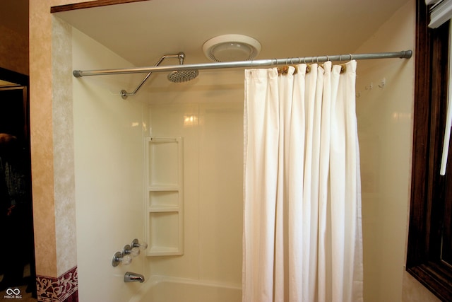 bathroom featuring shower / bath combination with curtain