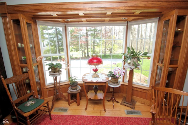 sunroom with visible vents and wood finished floors