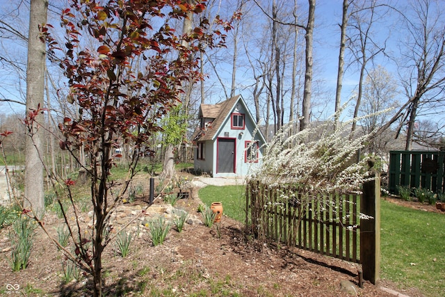 view of yard featuring fence and a gate