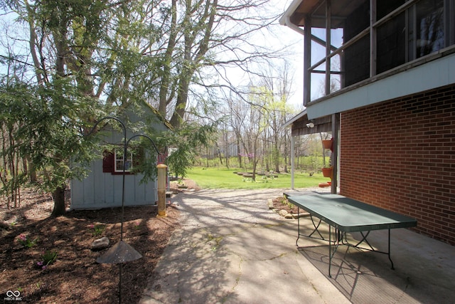 view of patio / terrace with an outdoor structure