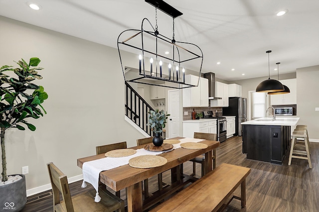 132 Oakhurst Way, Westfield, IN 46074 - dining area featuring baseboards, recessed lighting, dark wood-style flooring, and stairs