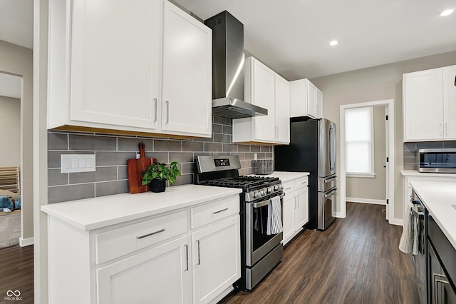 132 Oakhurst Way, Westfield, IN 46074 - kitchen featuring wall chimney range hood, stainless steel appliances, dark wood-style flooring, and light countertops