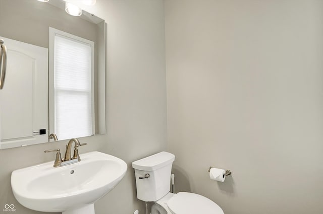 132 Oakhurst Way, Westfield, IN 46074 - half bathroom featuring a sink and toilet