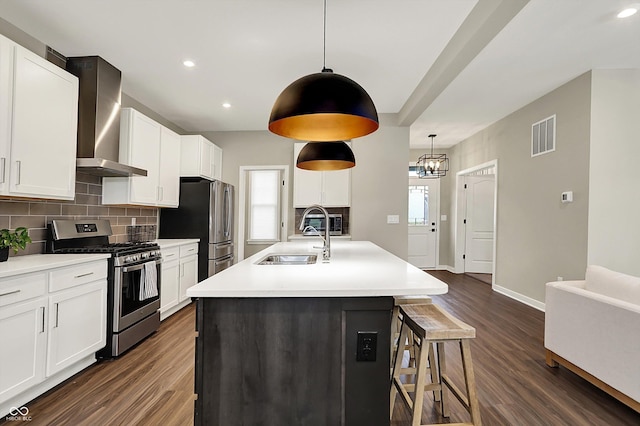 132 Oakhurst Way, Westfield, IN 46074 - kitchen with appliances with stainless steel finishes, a sink, wall chimney exhaust hood, backsplash, and dark wood-style floors