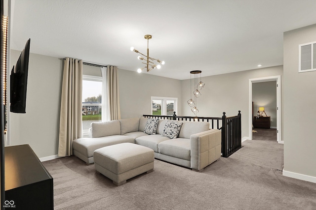132 Oakhurst Way, Westfield, IN 46074 - living room featuring baseboards, visible vents, an inviting chandelier, and carpet