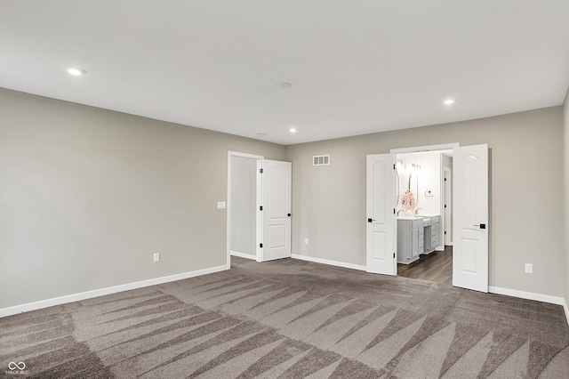 132 Oakhurst Way, Westfield, IN 46074 - empty room featuring recessed lighting, baseboards, and dark colored carpet
