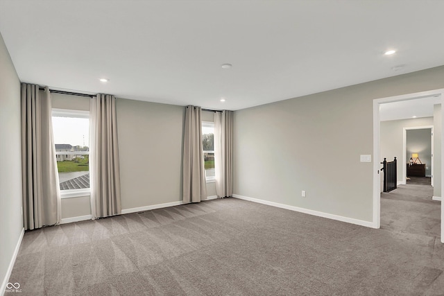132 Oakhurst Way, Westfield, IN 46074 - spare room with plenty of natural light, carpet flooring, and baseboards