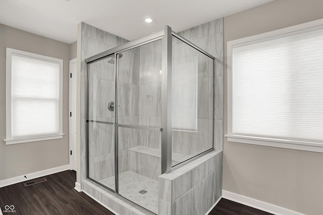 132 Oakhurst Way, Westfield, IN 46074 - full bathroom with baseboards, visible vents, tiled shower, and wood finished floors