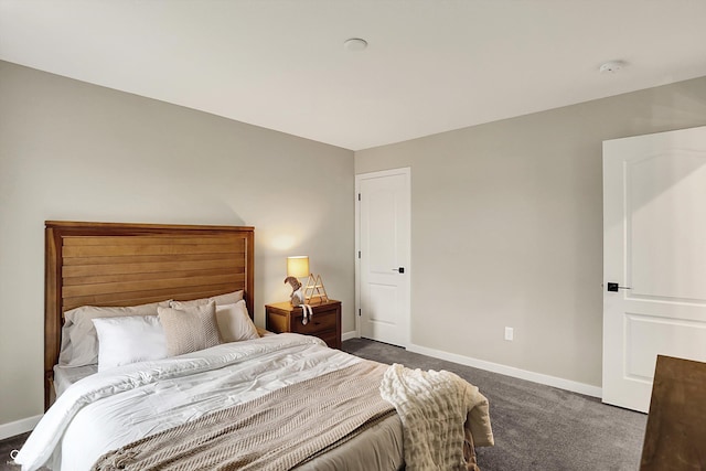 132 Oakhurst Way, Westfield, IN 46074 - bedroom with baseboards and dark colored carpet