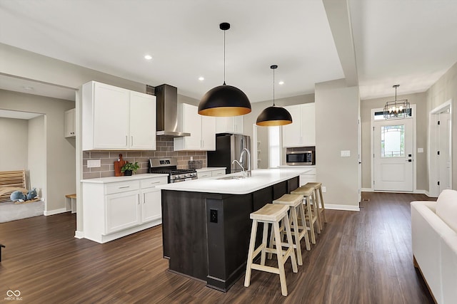 132 Oakhurst Way, Westfield, IN 46074 - kitchen featuring decorative backsplash, dark wood-style flooring, light countertops, stainless steel appliances, and wall chimney exhaust hood