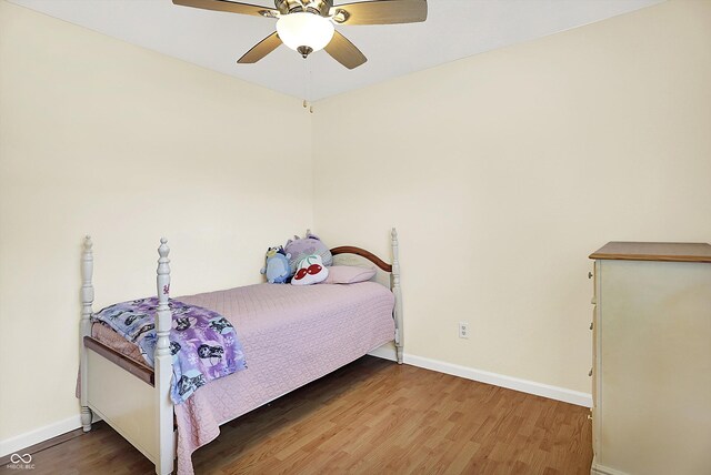 1697 Stacy Lynn Dr, Indianapolis, IN 46231 - bedroom featuring wood finished floors, baseboards, and a ceiling fan