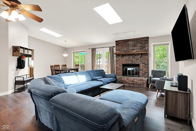 1697 Stacy Lynn Dr, Indianapolis, IN 46231 - living room featuring a skylight, plenty of natural light, dark wood finished floors, and vaulted ceiling