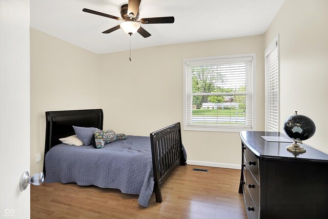 1697 Stacy Lynn Dr, Indianapolis, IN 46231 - bedroom with light wood-style flooring, baseboards, and ceiling fan