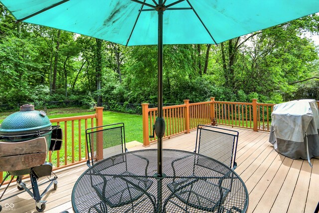 1697 Stacy Lynn Dr, Indianapolis, IN 46231 - wooden terrace featuring outdoor dining space, grilling area, and a view of trees